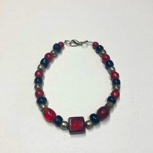 Handmade beaded bracelet in red and black. Original design